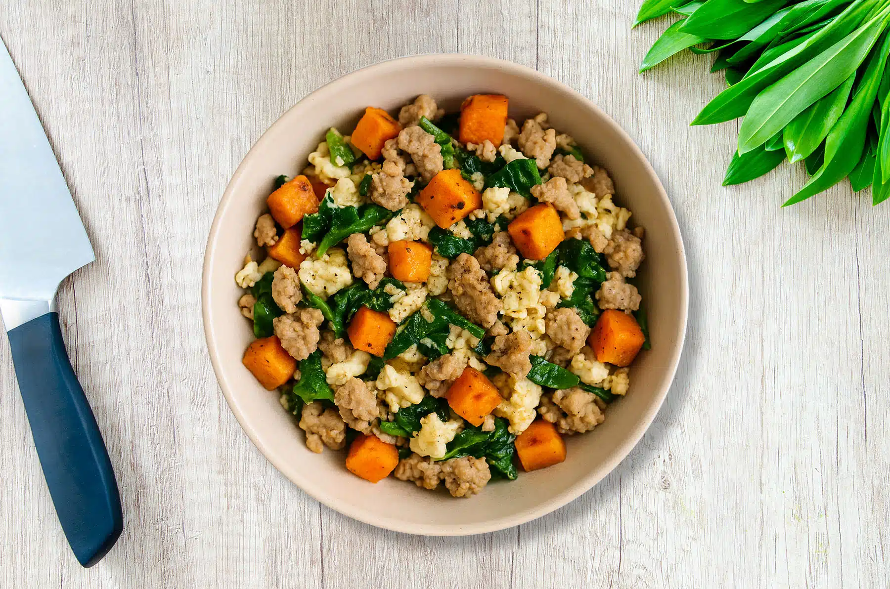 Ground Turkey, Egg Whites, and Sweet Potato High Protein Breakfast Bowl on table